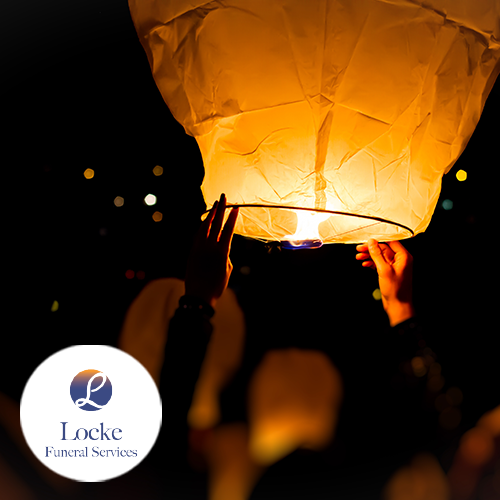 Lanterns being sent out into the night sky